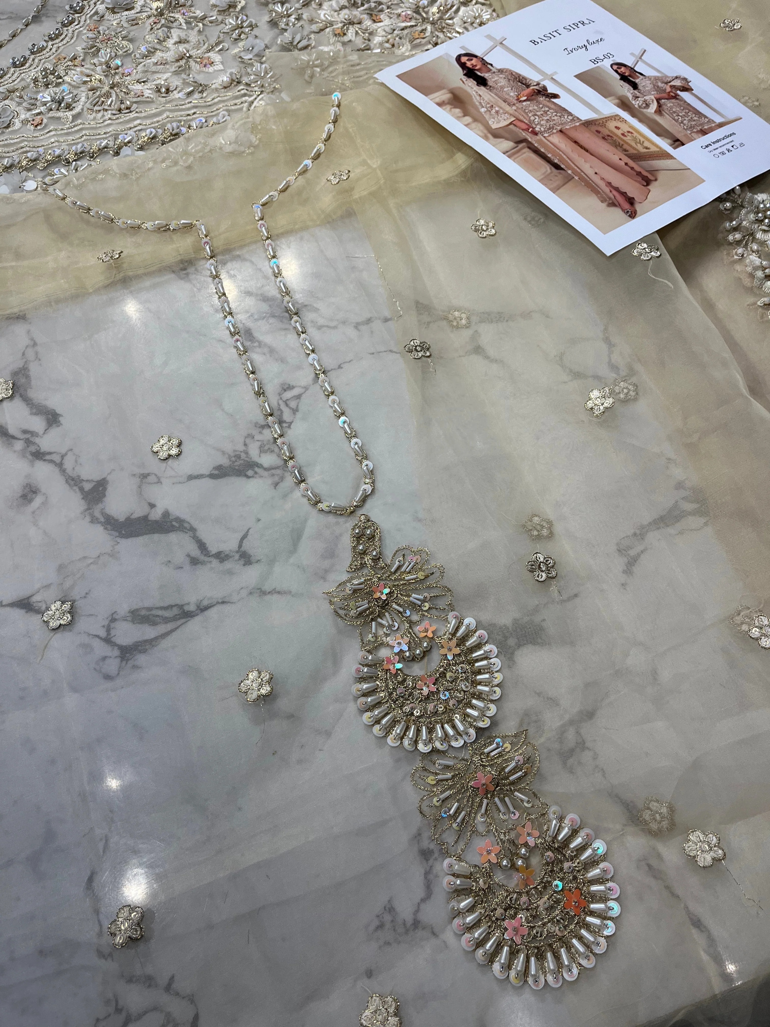 Ivory Luxe pakistani fashion outfit in ivory, beige, gold tones.